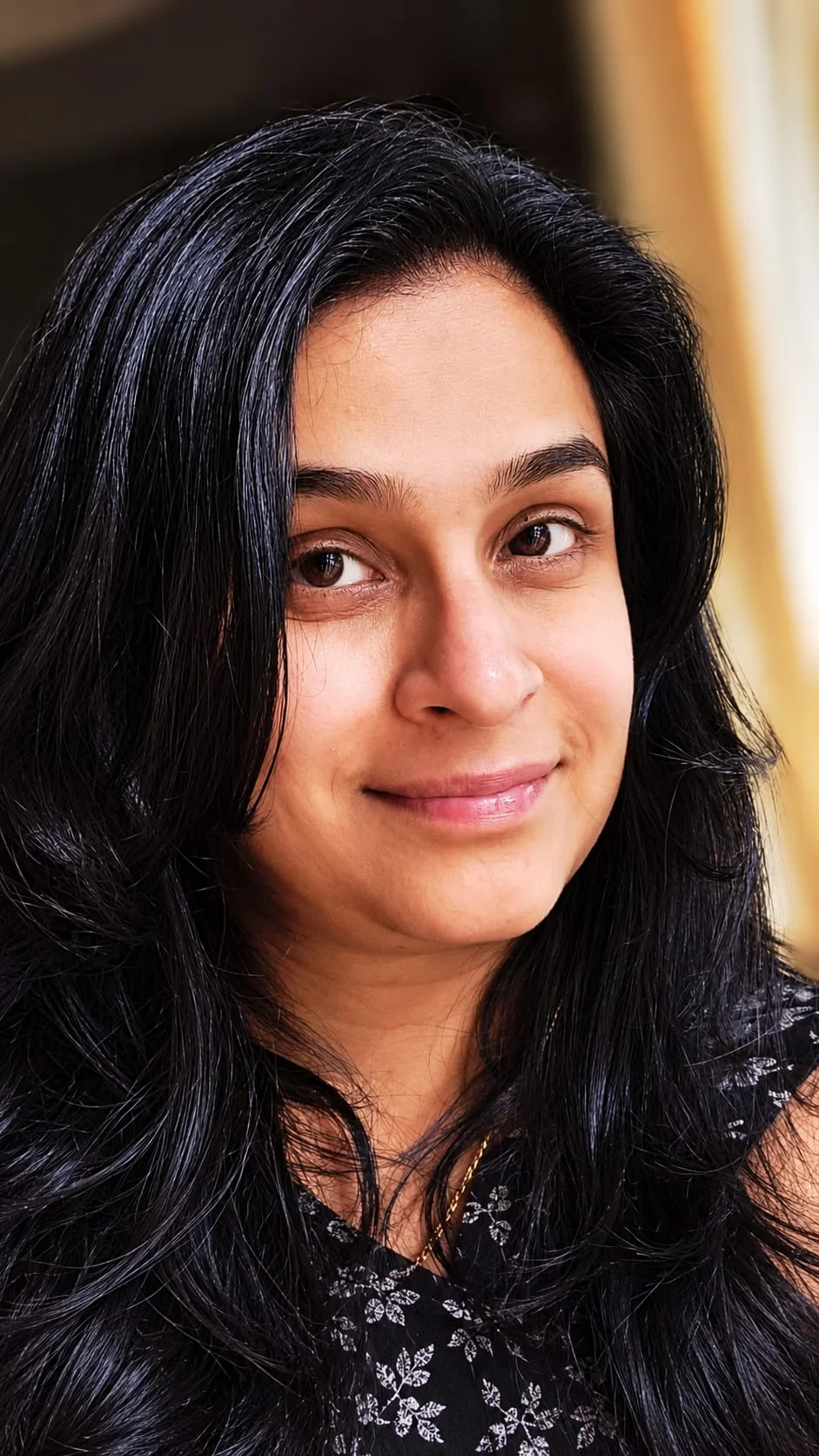Portrait of Ann, Accredited Mental Health Social Worker and psychotherapist, smiling warmly