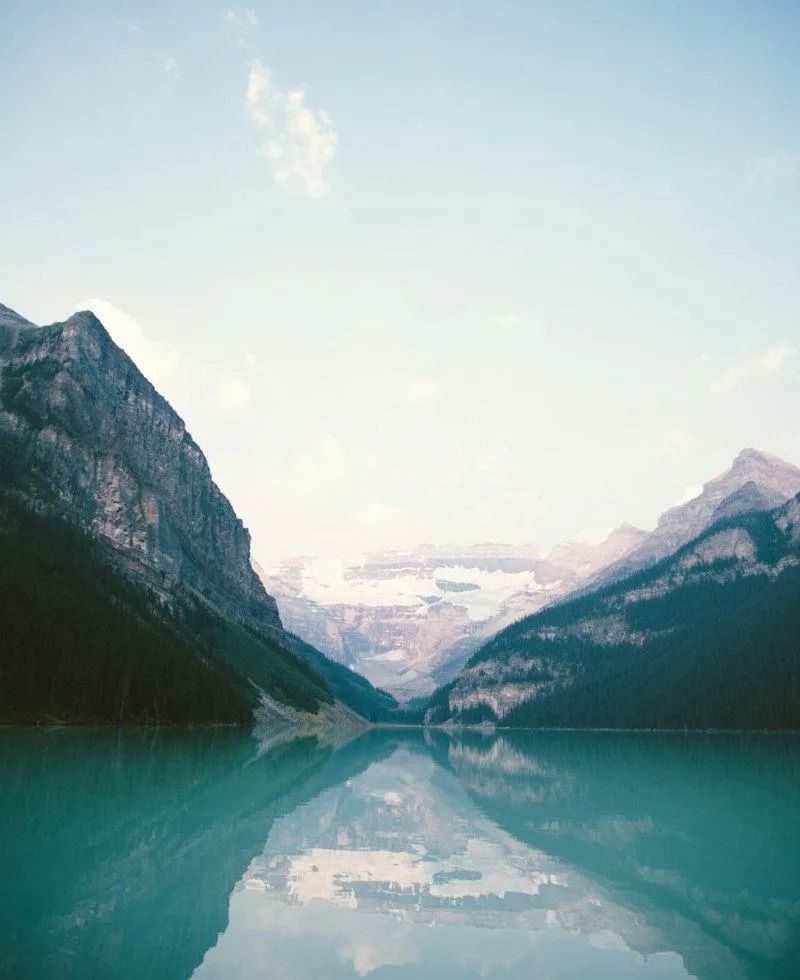 Mountains reflected in a still, clear lake